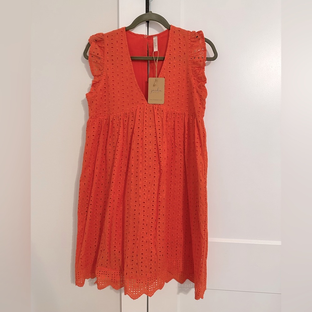 Tangerine, eyelet dress with shorts underneath